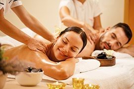 Two people relaxing while they are getting a massage.